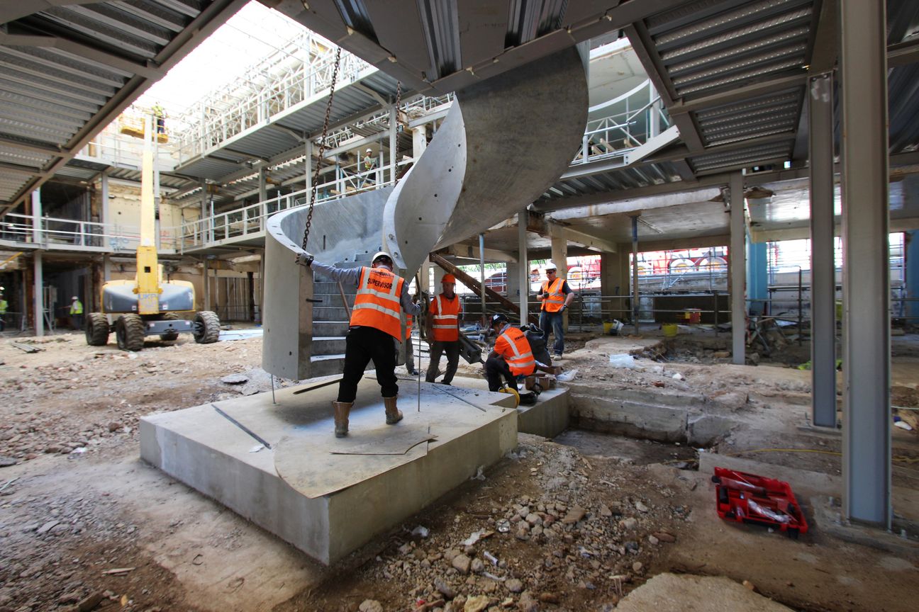 Milbank staff installing a helical precast concrete staircase at Denham Film Studios