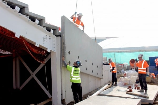 Milbank employees installing precast concrete stadium at the Kia Oval in London