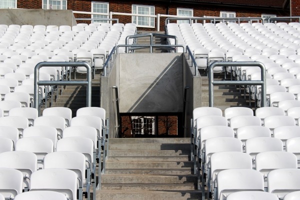 view of stadium chairs installed on precast concrete and stairwell