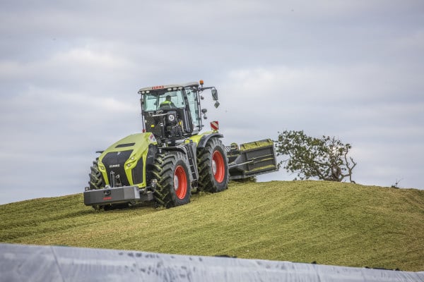 Claas tractor driving on silage