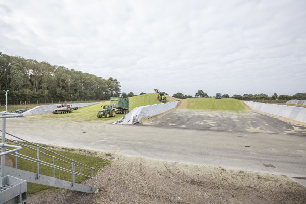 Tractors driving on silage in two precast concrete silage clamps side by side at Harper Adams University