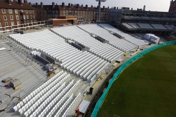 aerial view of stadium chairs being installed onto precast concrete base