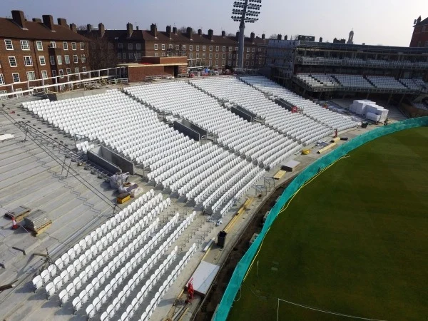 aerial view of stadium chairs being installed onto precast concrete base