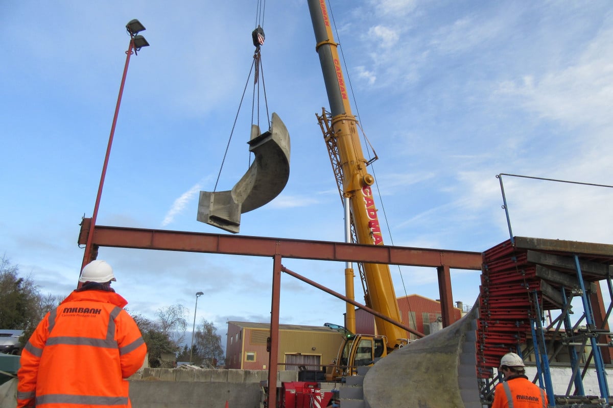 crane lift installation of precast concrete helical curved staircase