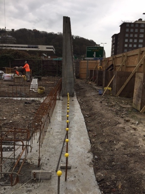 Installation of flint embossed precast concrete retaining wall in Dover, UK