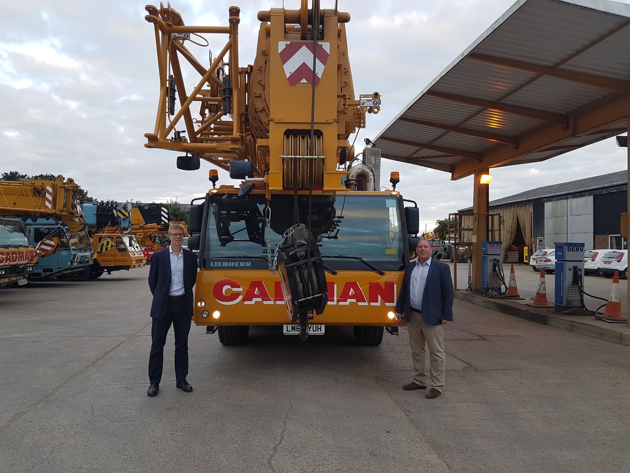 Sean Milbank and Andy Mayne stand in front of Cadman Crane