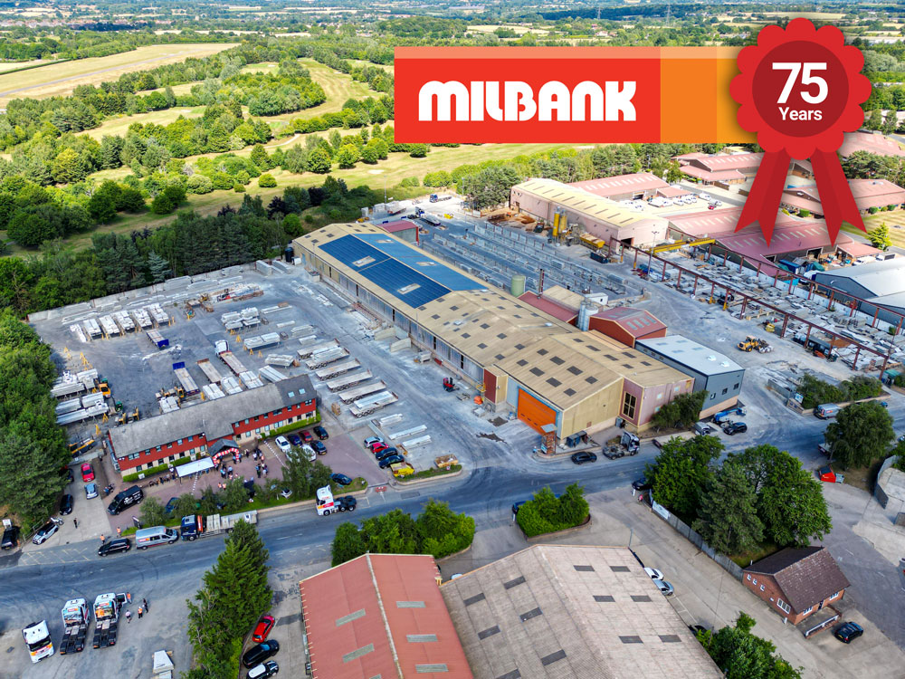 Aerial view of milbank concrete products factory with logo and 75th year anniversary rosette