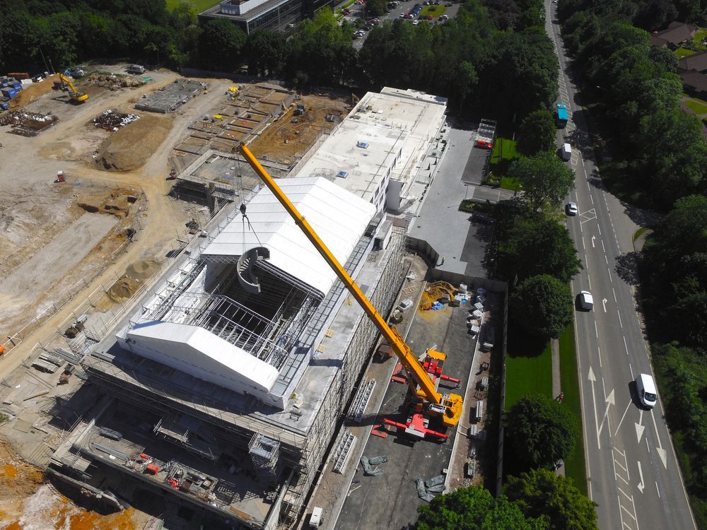 Crane installs bespoke spiral staircase into roof of Denham media centre