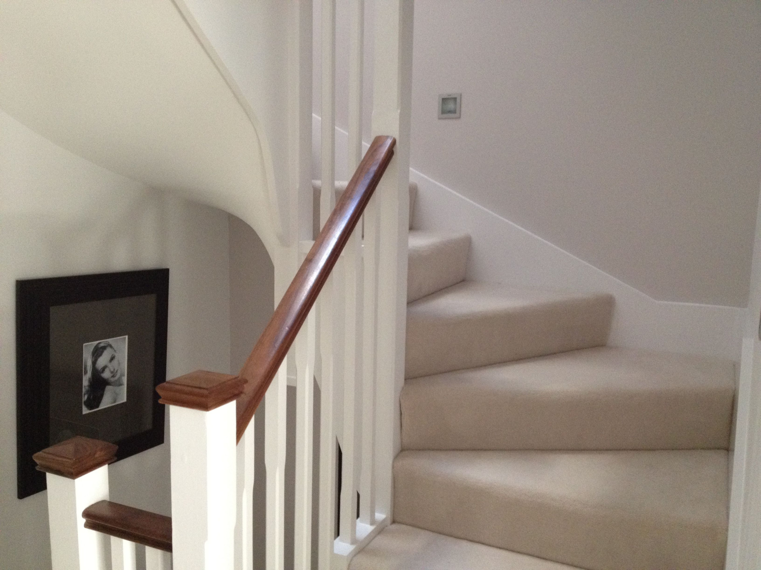 Bespoke winder staircase finished in cream carpet