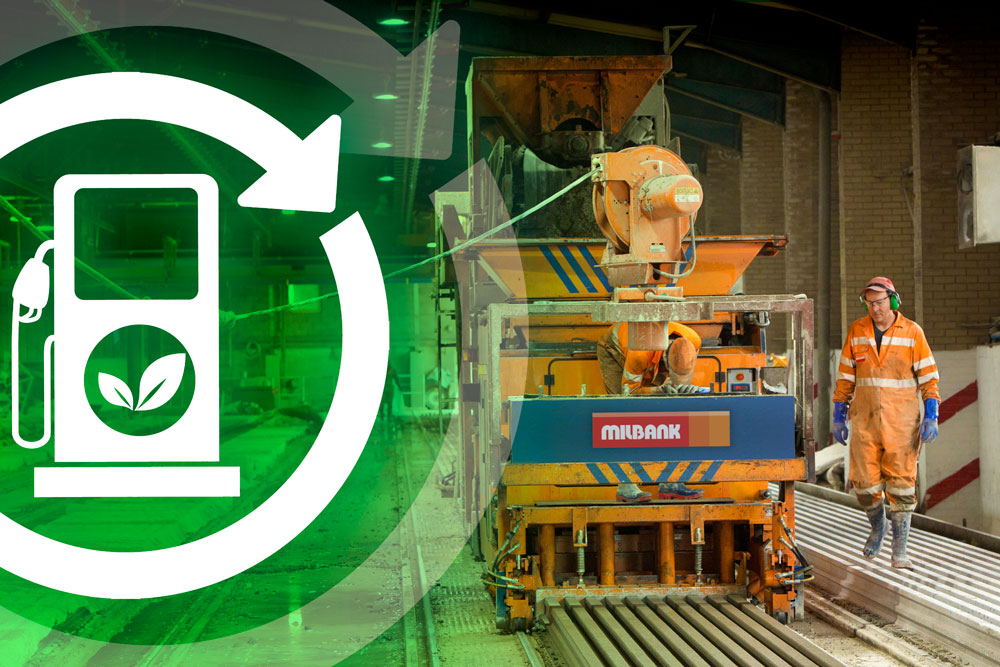 precast concrete beam machine works in factory with operatives. A green fuel logo overlays.