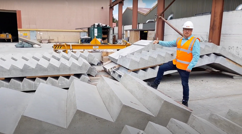 Mark Ellis poses with specialist precast concrete terrace stair in production yard