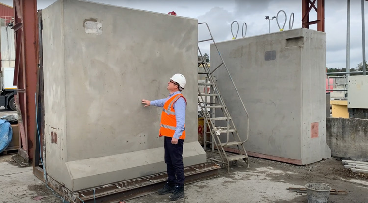 Mark Ellis stands in front of precast concrete nuclear neutron shields