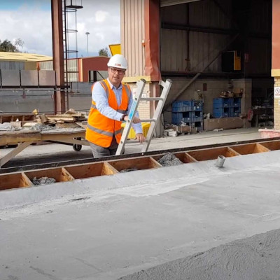 Mark Ellis climbs ladder in production yard