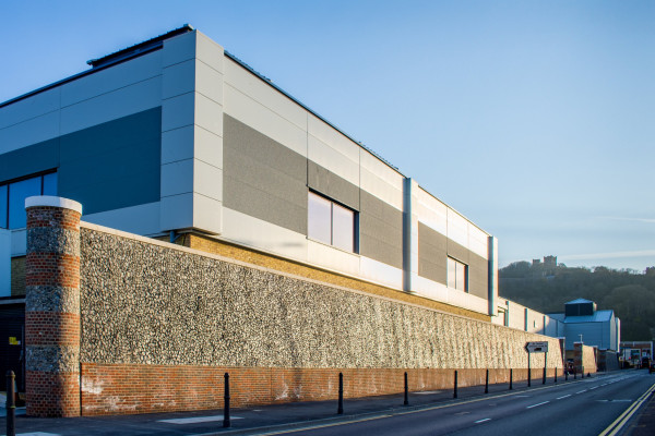 Flint embossed bespoke retaining walls installed at Dover retail park