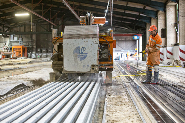 Milbank employee operates machinery to cut Hollowcore slabs in manufacture factory
