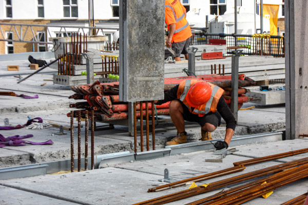 Milbank team member installs bespoke precast panel